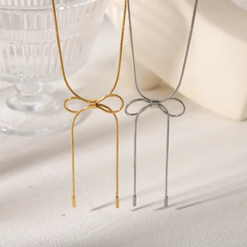 White Gold Plated Necklace With Long Bow Knot Detail
