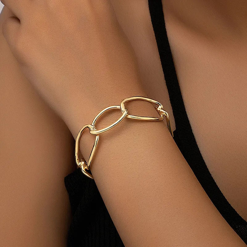 Gold Plated Bracelet With Oval Cutout And Open Cuff