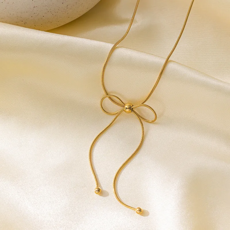 Gold Plated Bow Knot Necklace With Gold Bead Inlay