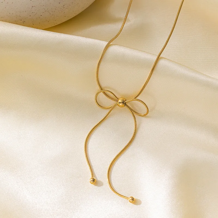 Gold Plated Bow Knot Necklace With Gold Bead Inlay