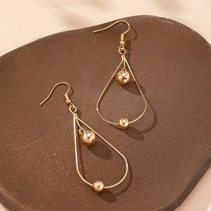 Gold Hollow Water Drop Earrings With Bead Details