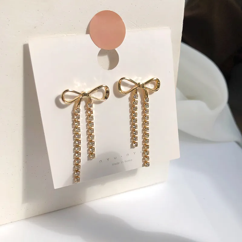 Gold And Rhinestone Drop Bow Earrings