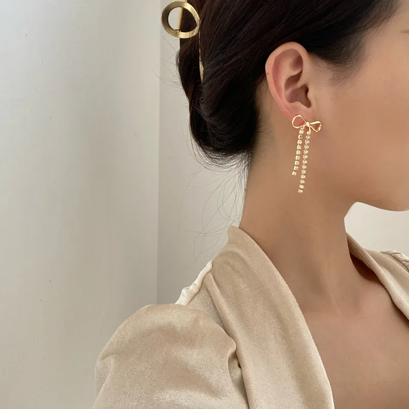 Gold And Rhinestone Drop Bow Earrings