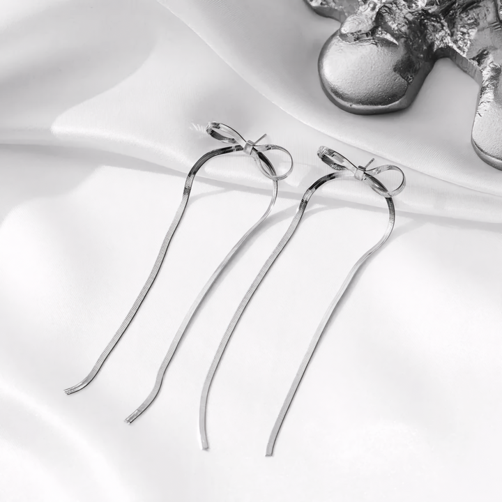 White Gold Stud Earrings With Long Bow Detail