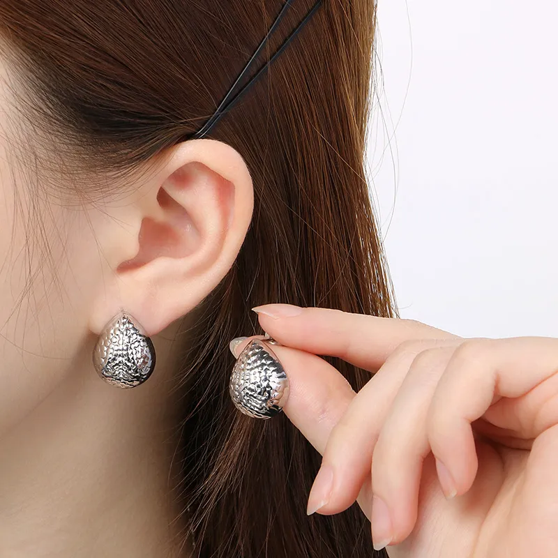 Textured Silver Coloured Water Droplet Earrings.