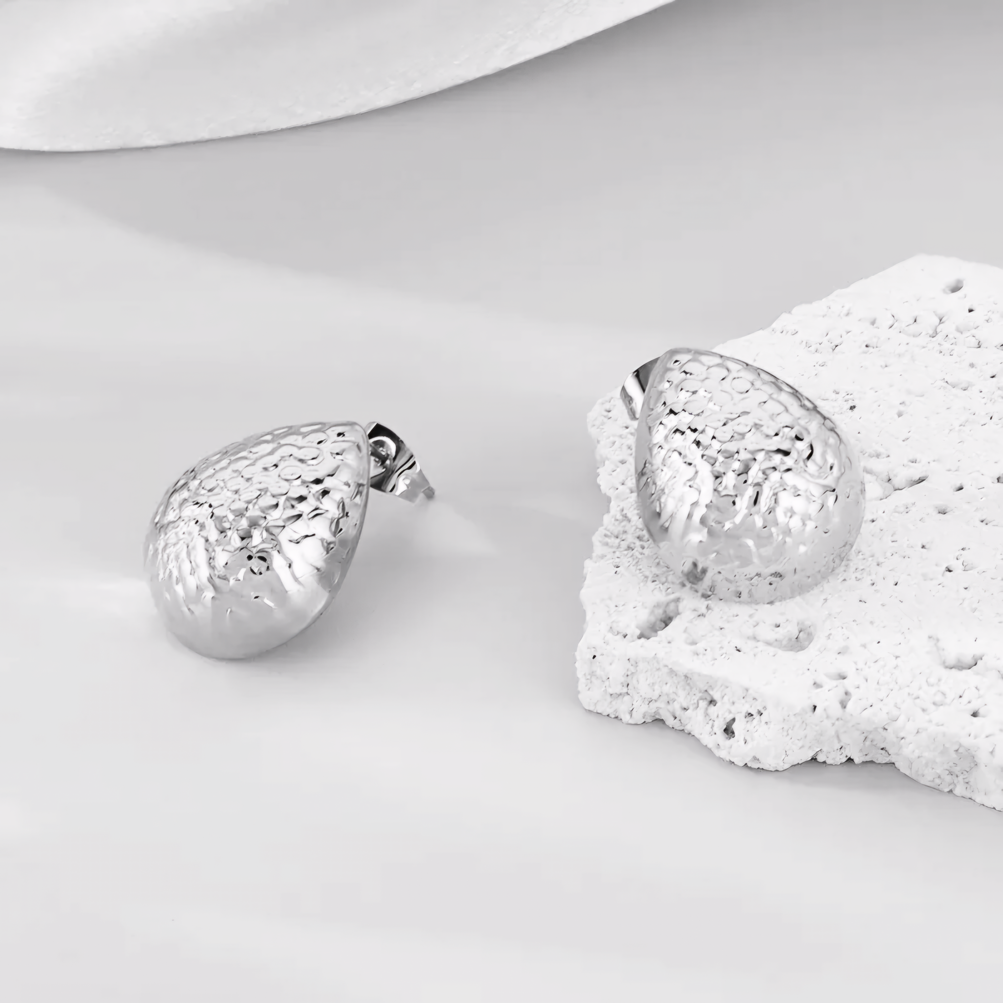 Textured Silver Coloured Water Droplet Earrings.