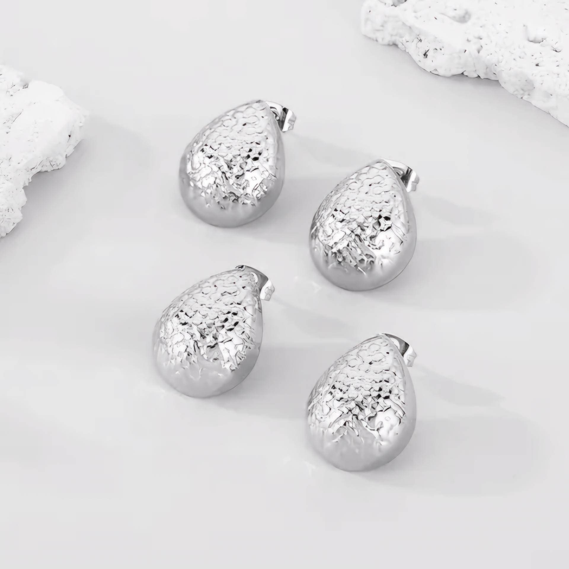Textured Silver Coloured Water Droplet Earrings.