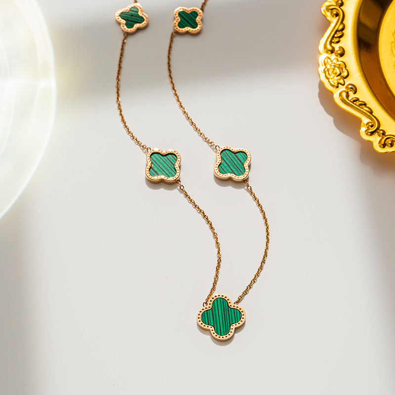 Gold plated multi motif clover necklace - green