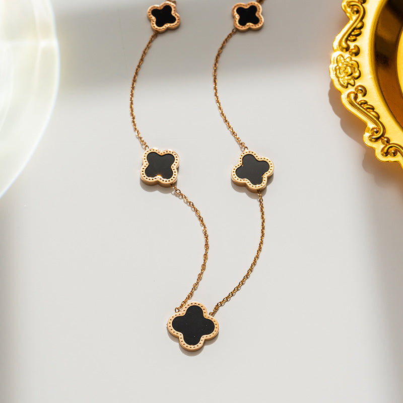 Gold plated multi motif clover necklace - black