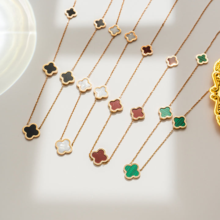 Gold plated multi motif clover necklace - white